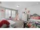 Cozy bedroom features a decorative teepee, soft textures, and natural lighting that create a relaxing atmosphere at 3255 Morgan Rd, Buford, GA 30519