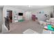 Large bonus room features carpeting, a built-in entertainment area, and flexible space for recreation or storage at 3255 Morgan Rd, Buford, GA 30519