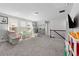 Bright bonus room features multiple windows, plush carpet and plenty of space for relaxing or playing at 3255 Morgan Rd, Buford, GA 30519