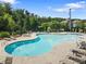 The community pool features a large swimming area, lounge chairs and tables, perfect for relaxation at 3255 Morgan Rd, Buford, GA 30519