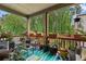 Relaxing back porch covered with plants and with plenty of room for seating and entertaining at 3255 Morgan Rd, Buford, GA 30519