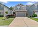 Charming two-story home with a gray garage door, stone accents, and a well-manicured lawn at 3255 Morgan Rd, Buford, GA 30519
