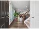 View of open concept living space featuring hardwood floors, staircase, and modern décor at 3255 Morgan Rd, Buford, GA 30519