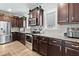 Galley style kitchen includes stainless appliances, granite countertops and ample storage space at 3255 Morgan Rd, Buford, GA 30519