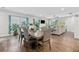 Open concept living room features hardwood floors, a ceiling fan, and lots of sunlight at 3255 Morgan Rd, Buford, GA 30519