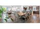 Spacious open-concept layout with a large dining table and an inviting living room area at 3255 Morgan Rd, Buford, GA 30519