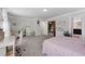 Spacious bedroom features plush carpet, a desk and a large bed with a decorative headboard at 3255 Morgan Rd, Buford, GA 30519