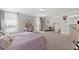 Spacious bedroom features plush carpet, a desk and a large bed with a decorative headboard at 3255 Morgan Rd, Buford, GA 30519