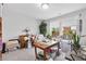 Bright office space with large window, potted plants, a chair and desk, creating an inspiring and functional workspace at 3255 Morgan Rd, Buford, GA 30519