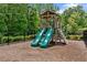 Community playground with two slides and a climbing structure, surrounded by fencing at 3255 Morgan Rd, Buford, GA 30519