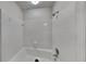 Tiled shower over tub featuring tile surround and modern fixtures at 3284 Salem Se Ln, Conyers, GA 30013