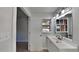Bright bathroom with a sleek vanity, modern lighting, and a window overlooking the exterior at 3284 Salem Se Ln, Conyers, GA 30013