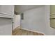 Hallway with LVP flooring, white walls, and lots of accessible storage at 3284 Salem Se Ln, Conyers, GA 30013