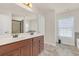 Bathroom featuring double vanity, large mirror, and tile flooring at 5711 Keys Way, Lithonia, GA 30058