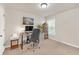 Bright bedroom featuring neutral walls, a comfortable office chair, and a sleek, modern desk and bookshelf at 5711 Keys Way, Lithonia, GA 30058