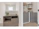 Upstairs laundry room with grey washer and dryer at 5711 Keys Way, Lithonia, GA 30058