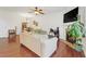 Bright living room featuring hardwood floors, a dining area, and a fireplace at 5711 Keys Way, Lithonia, GA 30058