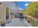 The patio has a seating area with a small metal table and two chairs in a backyard setting at 5711 Keys Way, Lithonia, GA 30058