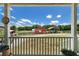 Backyard porch featuring a view of the stables, truck parking and a pasture at 654 Euharlee Five Forks Rd, Kingston, GA 30145