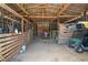 Bright barn interior with ample storage space, tractor, and vehicle parking, enhancing functionality at 654 Euharlee Five Forks Rd, Kingston, GA 30145