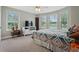 Bedroom featuring a neutral colored carpet, large windows, and a comfortable inviting bed at 654 Euharlee Five Forks Rd, Kingston, GA 30145