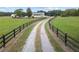 Picturesque home featuring a long driveway, fenced pasture, and an inviting country setting at 654 Euharlee Five Forks Rd, Kingston, GA 30145