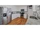 Modern kitchen with stainless steel appliances, granite countertops, and bright white cabinetry at 654 Euharlee Five Forks Rd, Kingston, GA 30145