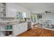 Bright kitchen featuring white cabinets, granite countertops, and stainless steel appliances at 654 Euharlee Five Forks Rd, Kingston, GA 30145