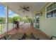 Spacious outdoor porch featuring ceiling fans, patio furniture, and relaxing views at 654 Euharlee Five Forks Rd, Kingston, GA 30145