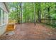 Backyard features a newly stained deck and stairs at 175 River Run, Roswell, GA 30075