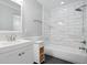 Updated bathroom has a shower-tub combo and vanity at 175 River Run, Roswell, GA 30075