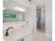 Bathroom featuring a large mirror, a walk-in glass shower and a white double sink vanity at 175 River Run, Roswell, GA 30075