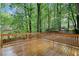 Large wooden deck overlooks the wooded backyard at 175 River Run, Roswell, GA 30075