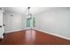Dining room with hardwood floors, large window, and modern lighting fixture at 175 River Run, Roswell, GA 30075