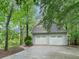 Three car garage with paved driveway at 175 River Run, Roswell, GA 30075