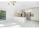 Open kitchen featuring stainless steel appliances, granite countertops, and ample cabinet space at 175 River Run, Roswell, GA 30075