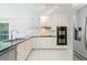 Close up of the kitchen showcasing modern appliances and plenty of cabinets at 175 River Run, Roswell, GA 30075