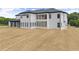 Expansive backyard featuring a covered outdoor patio on a new construction two-story home at 2021 Jones Phillips Rd, Dacula, GA 30019