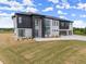 Striking two-story new construction home with black and white mixed brick design and modern window accents at 2021 Jones Phillips Rd, Dacula, GA 30019