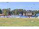 Walton High School baseball field with stadium seating and field house, with text reading 