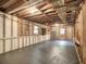 Spacious unfinished basement showing insulation, plumbing, and a walkout to the backyard at 351 Ridgewater Dr, Marietta, GA 30068
