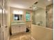 Bathroom with vanity, mirror, decorative tile backsplash, and a glass door shower at 351 Ridgewater Dr, Marietta, GA 30068