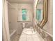 Bright bathroom featuring a shower/tub combination, tiled countertop, and window with natural light at 351 Ridgewater Dr, Marietta, GA 30068