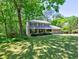 Charming two-story home with a well-manicured lawn, mature trees, and attached two car garage at 351 Ridgewater Dr, Marietta, GA 30068