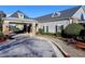 Elegant building featuring a covered entrance, gray siding, and professionally landscaped grounds at 351 Ridgewater Dr, Marietta, GA 30068