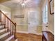 Bright foyer with hardwood floors, staircase, and closet for storage at 351 Ridgewater Dr, Marietta, GA 30068