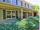 Inviting front porch with red door, decorative black shutters, and brick accents at 351 Ridgewater Dr, Marietta, GA 30068