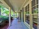 Inviting covered front porch and walkway featuring updated hardware and exterior paint at 351 Ridgewater Dr, Marietta, GA 30068