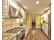 Galley kitchen with granite countertops, stainless steel appliances, and custom cabinetry at 351 Ridgewater Dr, Marietta, GA 30068