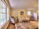 Comfortable living room with hardwood floors, neutral paint, and large windows at 351 Ridgewater Dr, Marietta, GA 30068